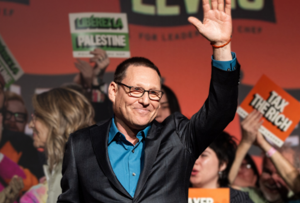 New Democratic Party of Canada image of Avi Lewis before Megavision Productions, and Client Scout e-Branding performed Advanced Image Cloning for My e-Canada Word On The Street Investigative News Exposé